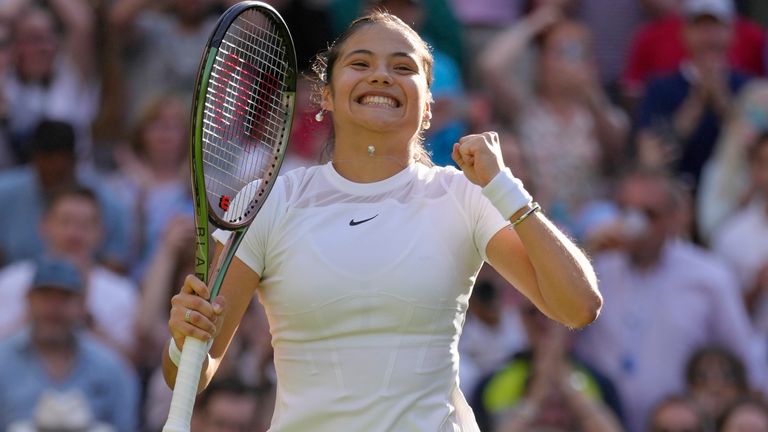 Britain's Emma Raducanu celebrates beating Belgium's Alison van Uytvanck to win a women's first round singles match on day one of the Wimbledon tennis championships in London, Monday, June 27, 2022. (AP Photo/Kirsty Wigglesworth)