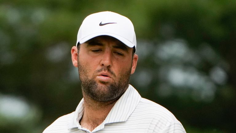 Scottie Scheffler reacts after missing a putt on the seventh green during the third round of the Travelers Championship golf tournament at TPC River Highlands, Saturday, June 22, 2024, in Cromwell, Conn. (AP Photo/Seth Wenig)