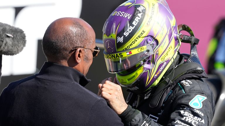 Mercedes driver Lewis Hamilton of Britain celebrates with his father after winning the British Formula One Grand Prix race at the Silverstone racetrack, Silverstone, England, Sunday, July 7, 2024. (AP Photo/Luca Bruno)