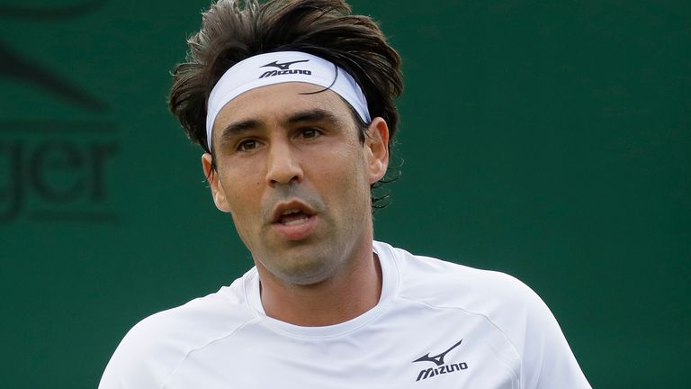 Marco Baghdatis of Cyprus celebrates winning a point against Germany's Jan-Lennard Struff in a Men's singles match during day two of the Wimbledon Tennis Championships in London, Tuesday, July 2, 2019. (AP Photo/Kirsty Wigglesworth)