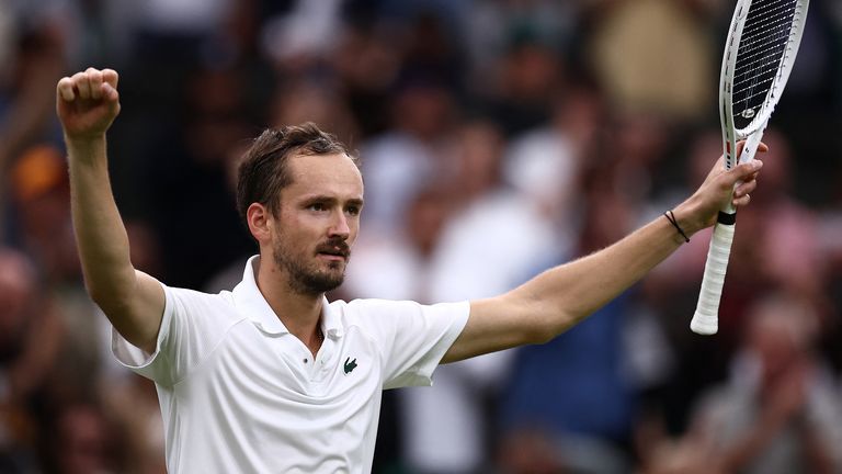 Russia's Daniil Medvedev celebrates winning against Italy's Jannik Sinner during their men's singles quarter-final tennis match on the ninth day of the 2024 Wimbledon Championships at The All England Lawn Tennis and Croquet Club in Wimbledon, southwest London, on July 9, 2024. Medvedev won the match 6-7, 6-4, 7-6, 2-6 6-3. (Photo by HENRY NICHOLLS / AFP) / RESTRICTED TO EDITORIAL USE