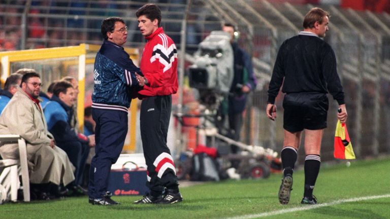 England boss Graham Taylor (left) confronts the fourth official and assistant referee.