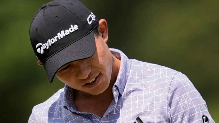 Collin Morikawa reacts to a putt on the fifth green during the second round of the Tour Championship golf tournament, Friday, Aug. 30, 2024, in Atlanta. (AP Photo/Mike Stewart)