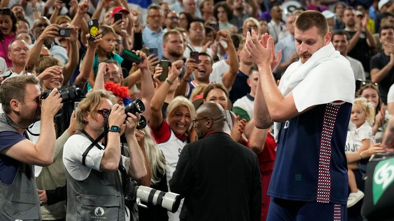 Nikola Jokic (15), of Serbia claps after Serbia beat Germany for the bronze during a men's bronze medal basketball game at Bercy Arena at the 2024 Summer Olympics, Saturday, Aug. 10, 2024, in Paris, France. (AP Photo/Mark J. Terrill)