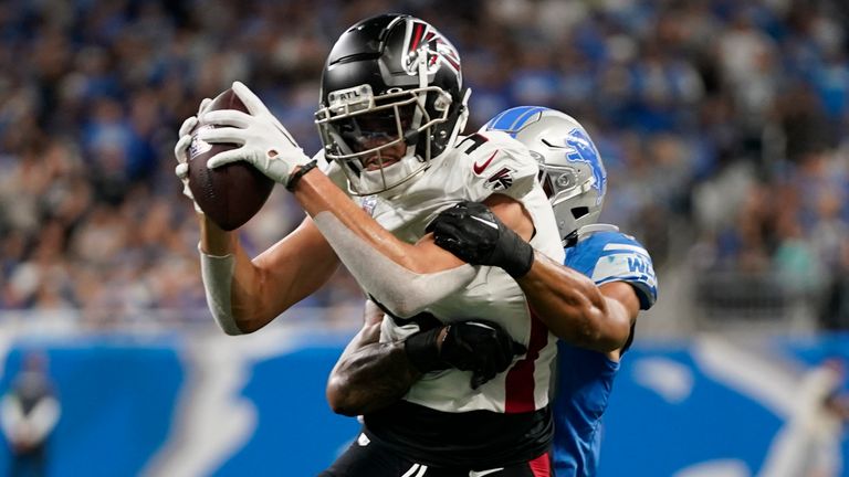 Atlanta Falcons wide receiver Drake London (5) tries to break free from Detroit Lions safety Brian Branch (32) during an NFL football game in Detroit, Sunday, Sept. 24, 2023. (AP Photo/Paul Sancya)