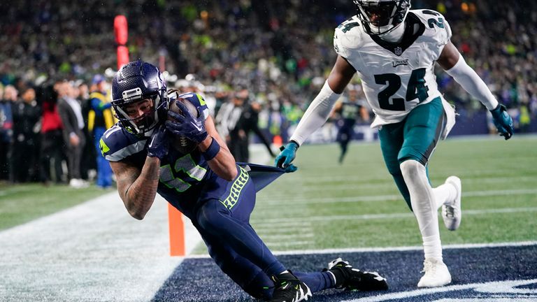 Seattle Seahawks wide receiver Jaxon Smith-Njigba makes a touchdown catch against Philadelphia Eagles cornerback James Bradberry (24) during the second half of an NFL football game, Monday, Dec. 18, 2023, in Seattle. The Seahawks won 20-17. (AP Photo/Lindsey Wasson)